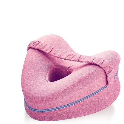 Pink side-sleeper knee pillow, three-quarter studio view on a white background