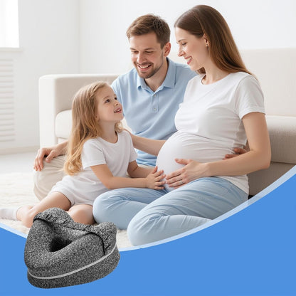 Pregnant woman with her partner and child at home beside the gray knee pillow