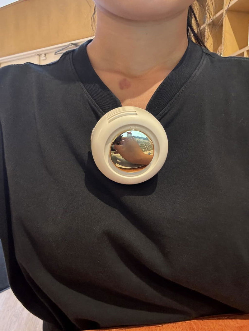 Review photo: a white clip-on bladeless fan clipped to the neckline of a dark T-shirt