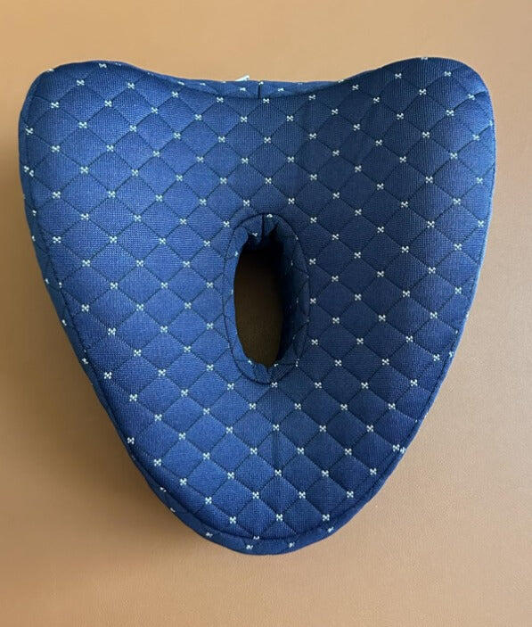 Review photo: the navy quilted side-sleeper knee pillow seen from above on a table